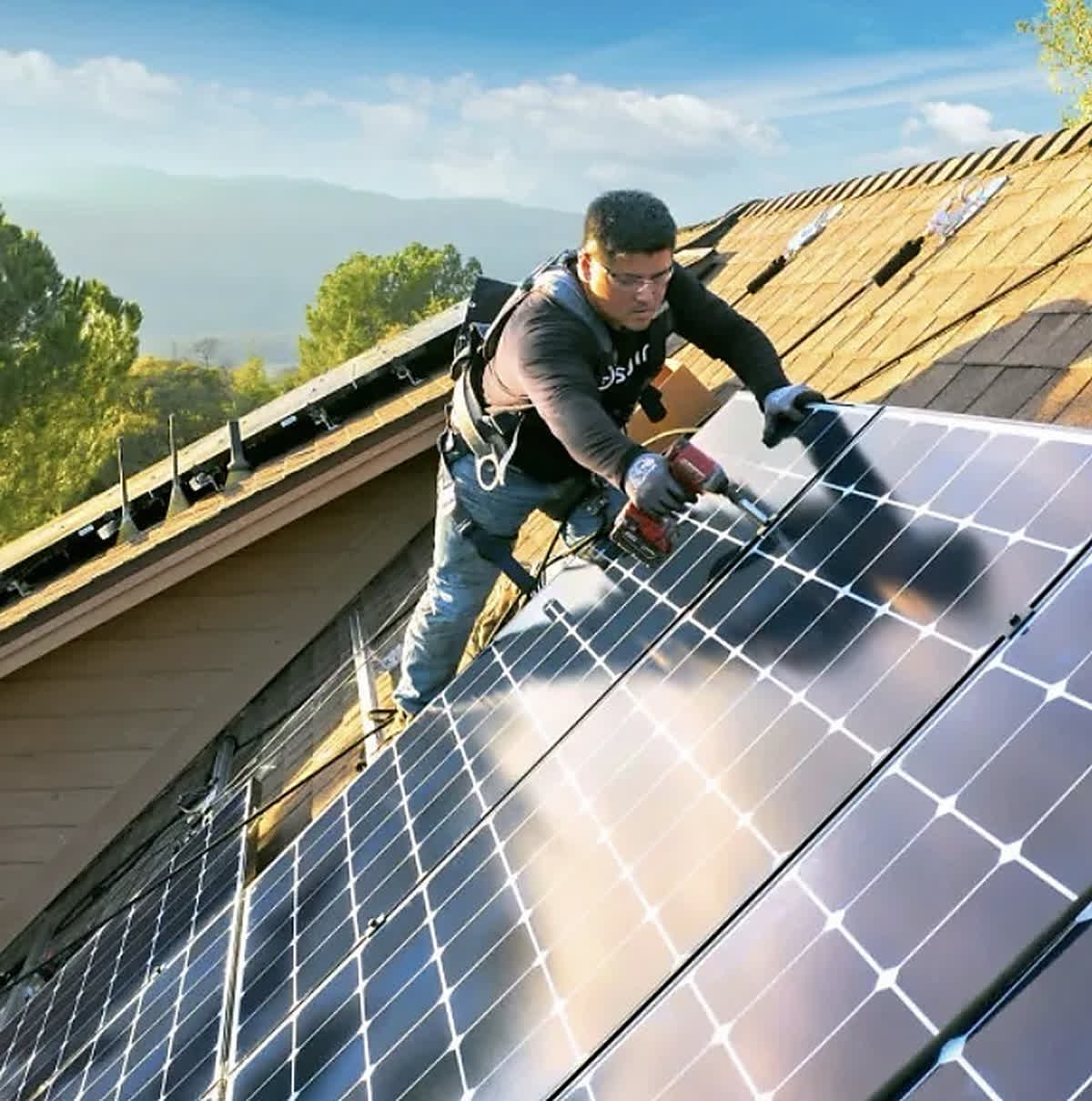 Solar panels being installed on a home roof in California